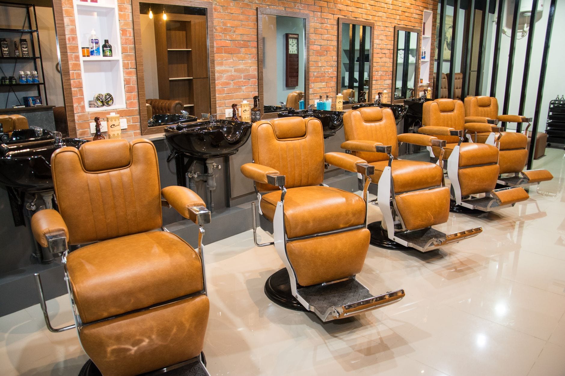 Barbershop interior with leather barber chairs and mirrors